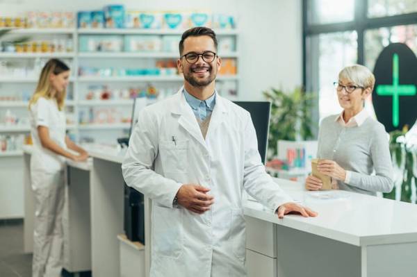 young-female-pharmacist-posing-while-working-in-a-pharmacy-e1697689073593-1024x681-1.jpg