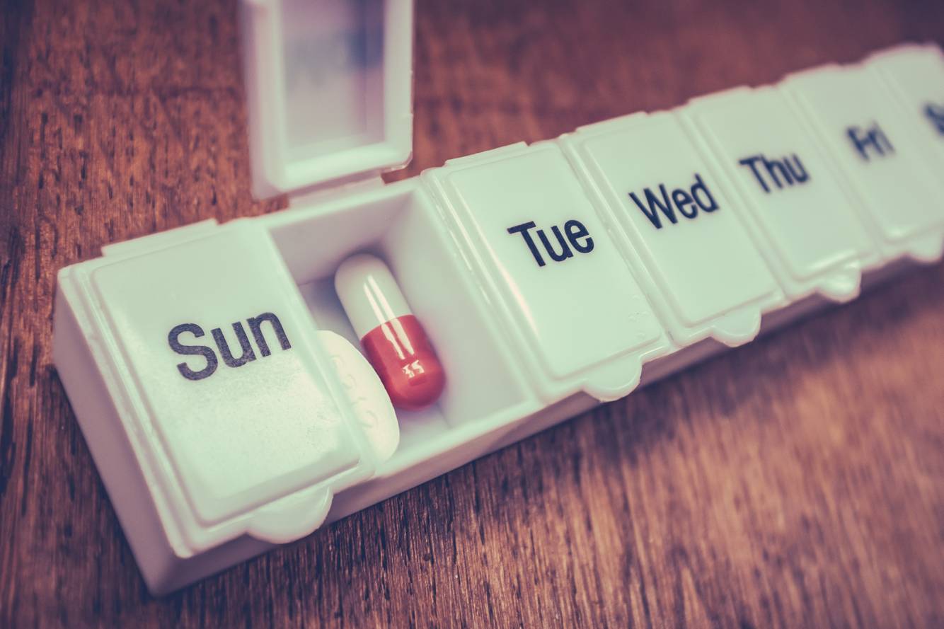 Image of medications inside a pill organizer Medication Adherence