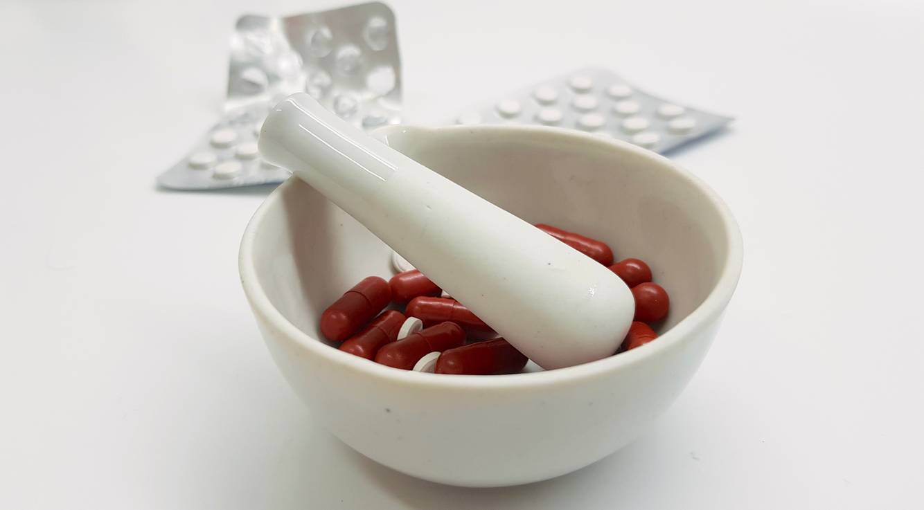 Image of medications inside a mortar and pestle Compounding