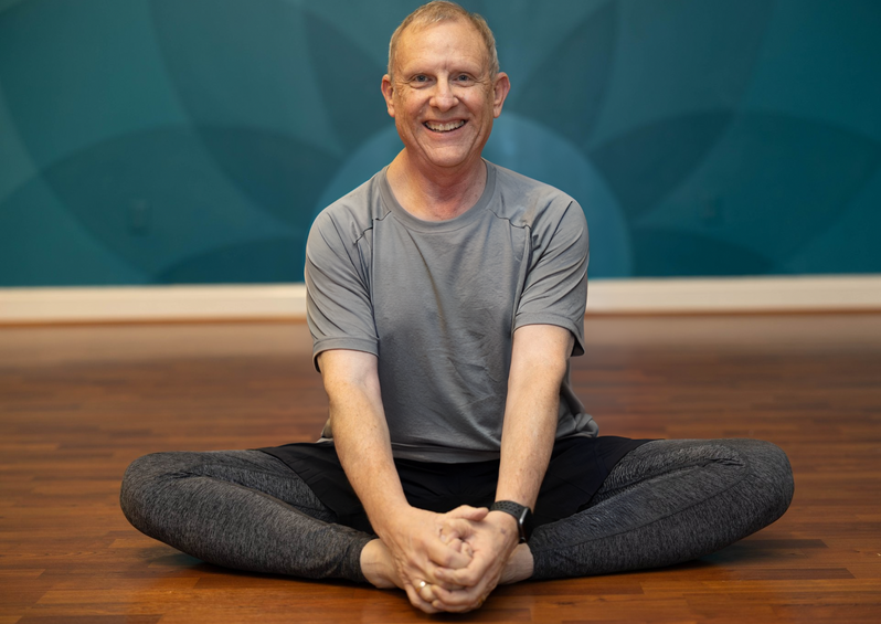 Daryl Bozovich a certified yoga teacher at Om Shanti Yoga in Burlington NC teaching yin, slow flow, hot yoga and restorative