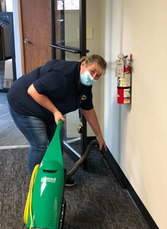 Clean Team Employee Vaccuming