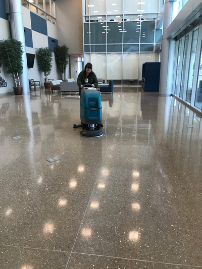 Clean Team Employee making the terrazzo floors shine