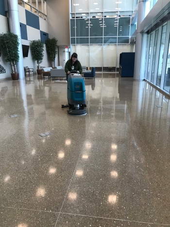 Clean Team Employee making the terrazzo floors shine