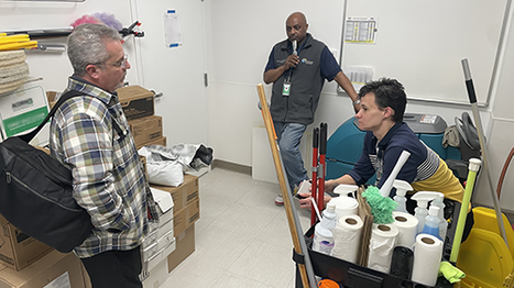 Crew getting the supply closet organized.