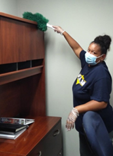 Clean Team Employee Cleaning Desk