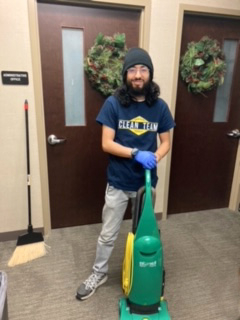 Clean Team Employee with Vaccum