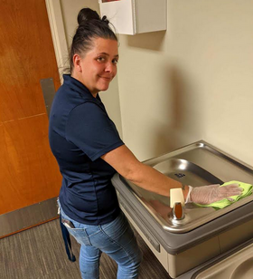 Clean Team Employee Cleaning Water Fountatin