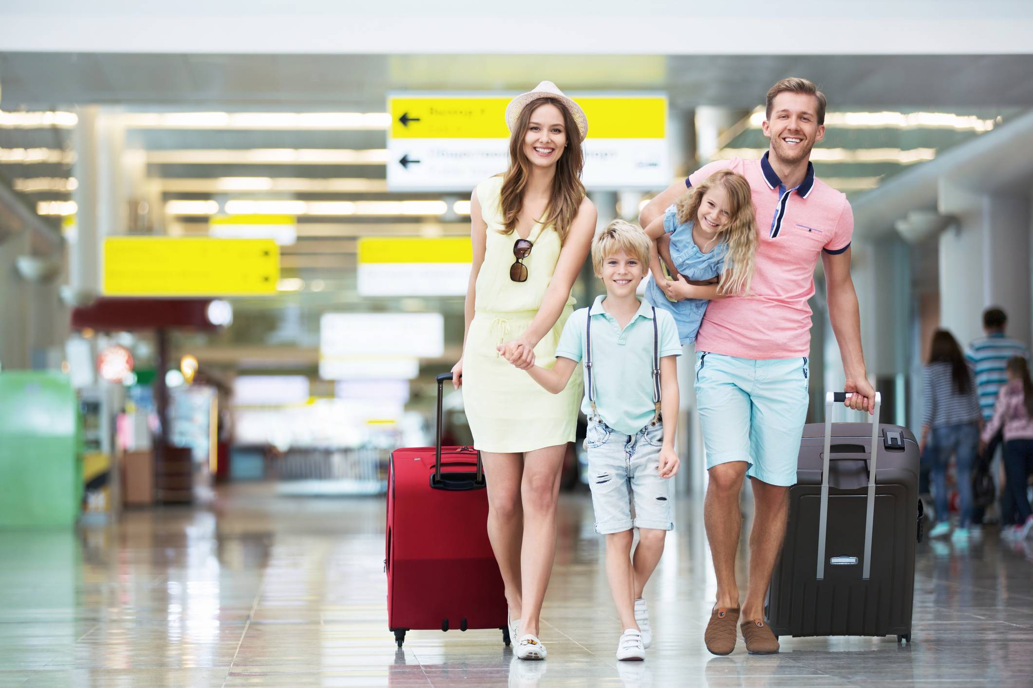 Family walking in an airport Travel Vaccinations