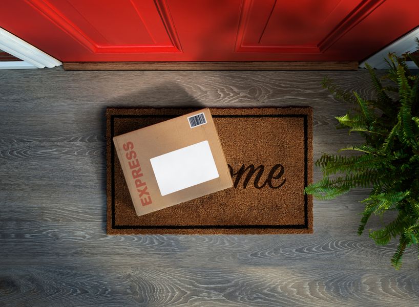 Package sitting on a door mat Delivery