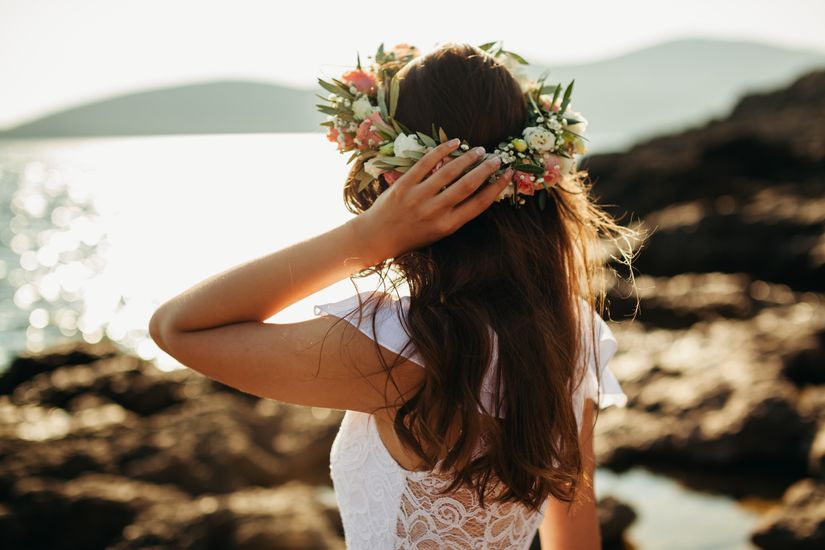 woman-in-bridal-wreath-on-beach-AXETBPP.jpg
