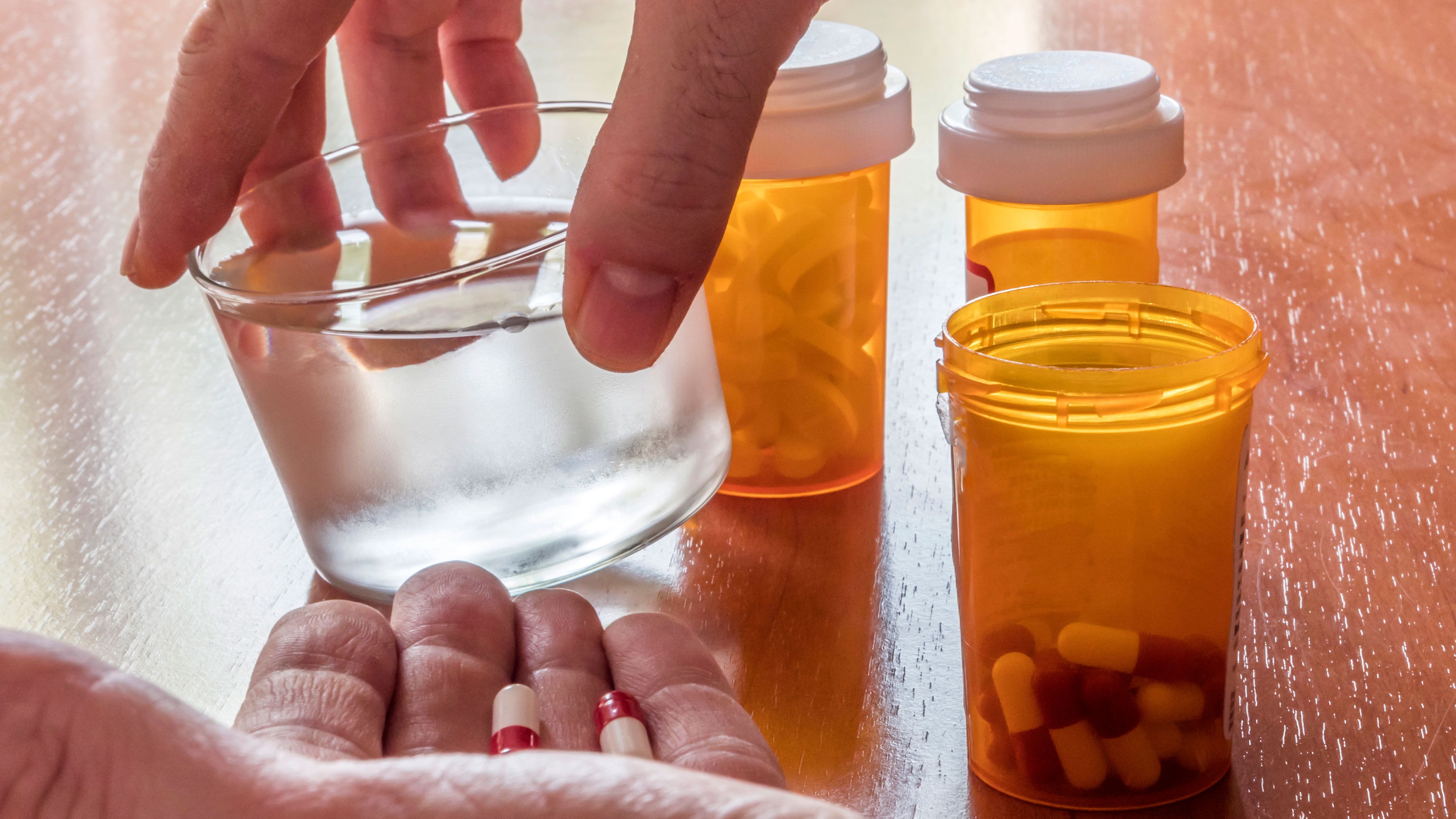 pharmacy-pills-in-hand-iStock-1086688144.jpg