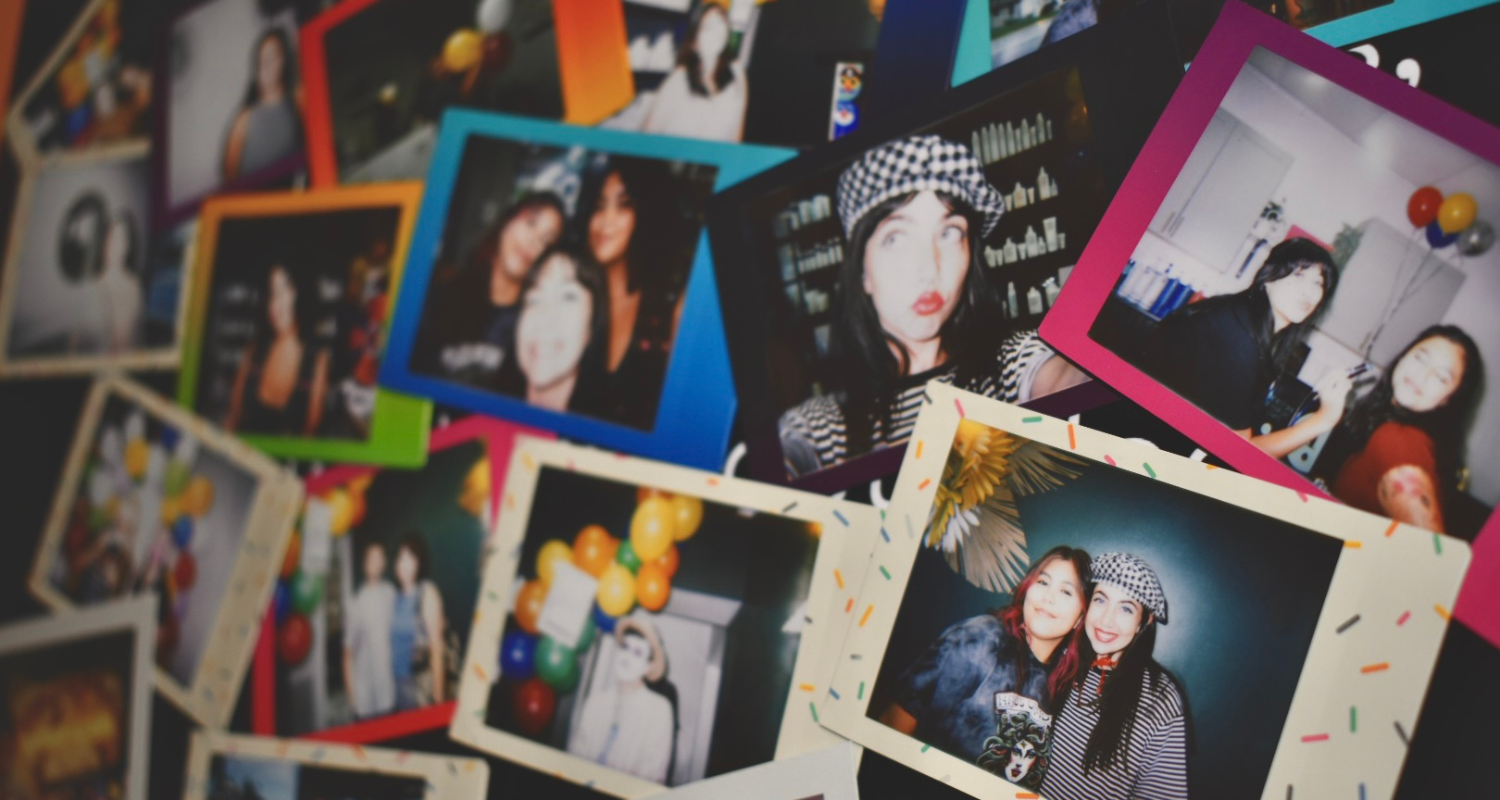 A colorful wall of Polaroid photos showing Haus of FIDI clients and team moments from community events in Pensacola, Florida. Wall of Polaroid photos from Haus of FIDI community events