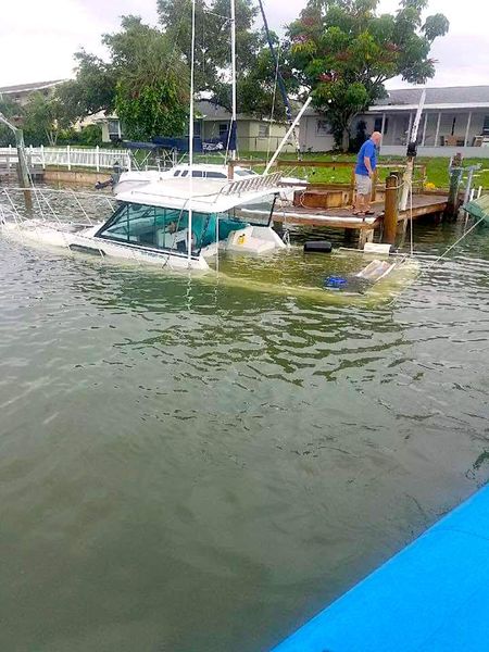 Flood damaged vessel recovery performed by Flagship Towing marine salvage crew.