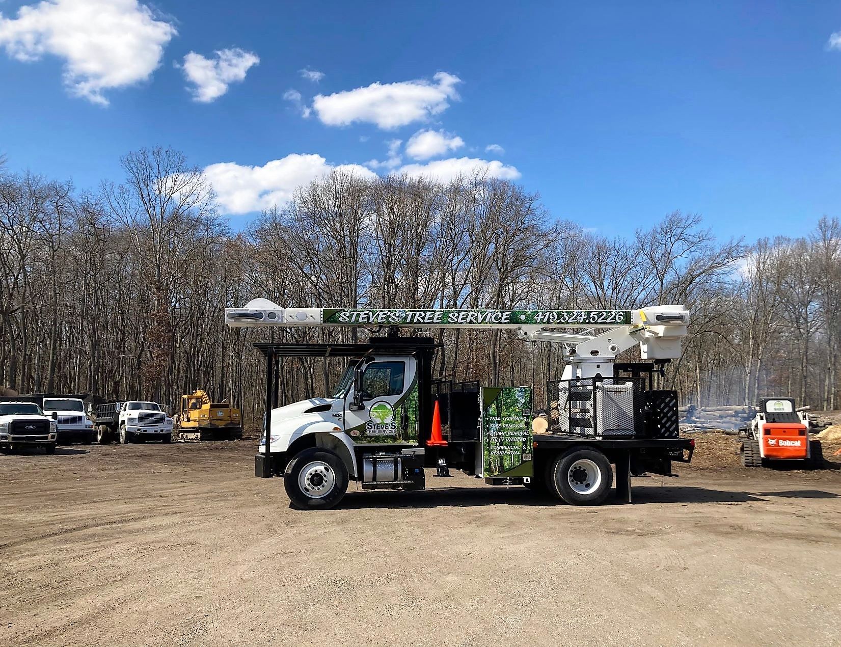 Steve’s Tree Service Bucket Truck Performing Tree Removal in Toledo, Ohio