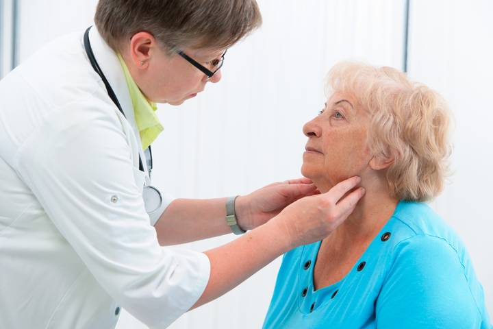 Image of pharmacist administering a strep test