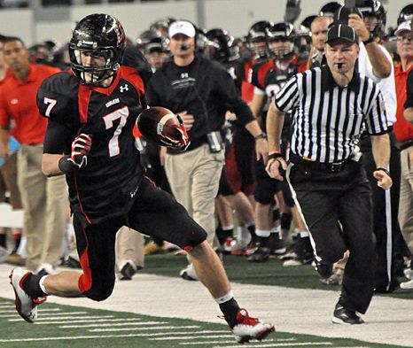 Griffin Gilbert looks for the nearest defender as he heads upfield after a catch. Gilbert after catch.jpg