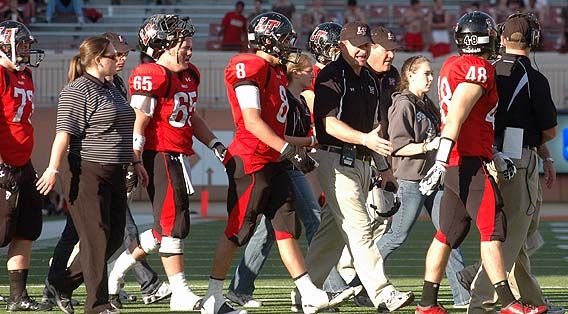 Head coach Hank Carter encourages Tyler Paulsen (8) and Jacob Garner (48) during a time out. DSC_0137.jpg