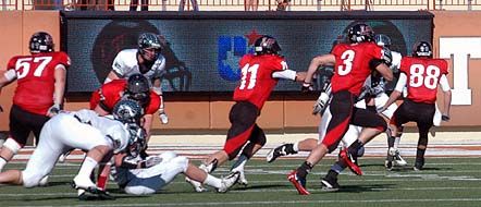 Michael Pojman runs for the corner as Tanner Gillette (11) and Conner Floyd (88) provide blocking. dsc_0073.jpg