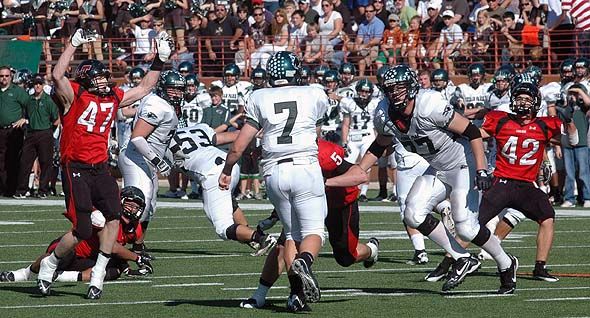 Dylan Bittles (47) and Corbin Crow (42) apply pressure to Cedar Park quarterback Alex Curl. DSC_0028.jpg