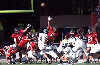 A Cedar Park field goal, over the rush of Tyler Paulsen (8) and Shaq Marable (9), cut Lake Travis' lead to 21-20. DSC_0121.jpg
