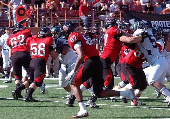 Lake Travis' offensive line walls off Cedar Park's defenders. DSC_0045.jpg