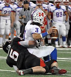 Blake Burdette pulls down Midway quarterback Kramer Robertson. burdette sack.jpg