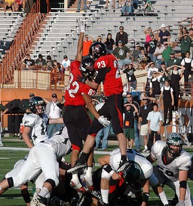 Dannon Cavil (82) and Griffin Gilbert (23) try to block a late Cedar Park field goal try. DSC_0146.jpg