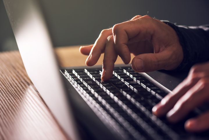 Image of a person typing on a laptop Online Refills
