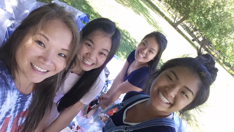 Chris and her daughters enjoying a day at the park.