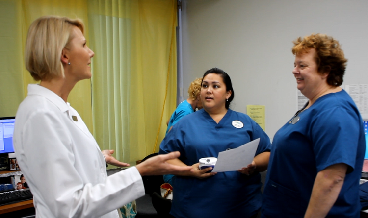 Laurie discusses a new patient with Pharmacare nurses like Nikki Garcia (center) and Tine Whetstone (right). Nurses Chatting.png