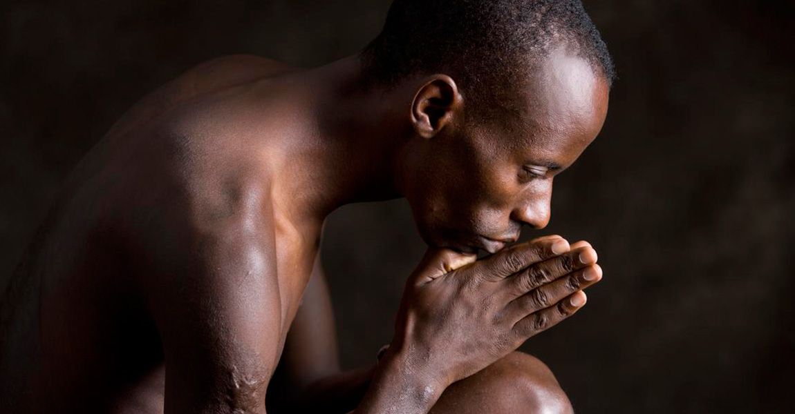 Gilbert Tuhabonye in prayer