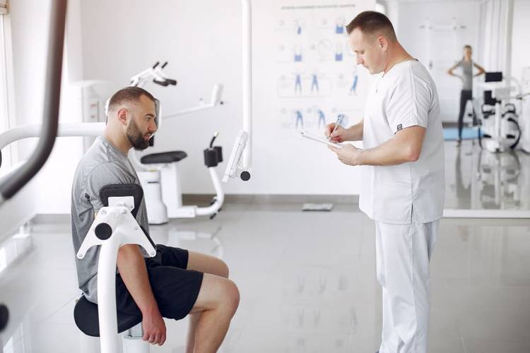 doctor-with-patient-physiotherapy-clinic.jpg