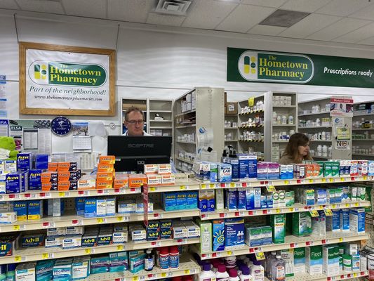 Pharmacy Counter with Employees