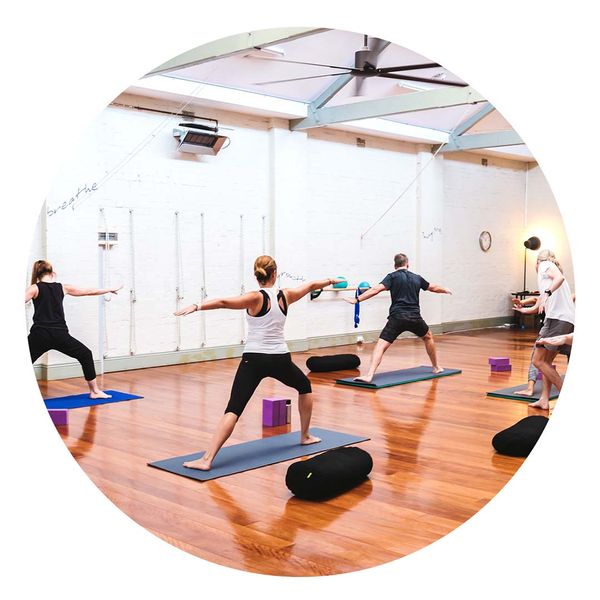 A class doing a yoga class