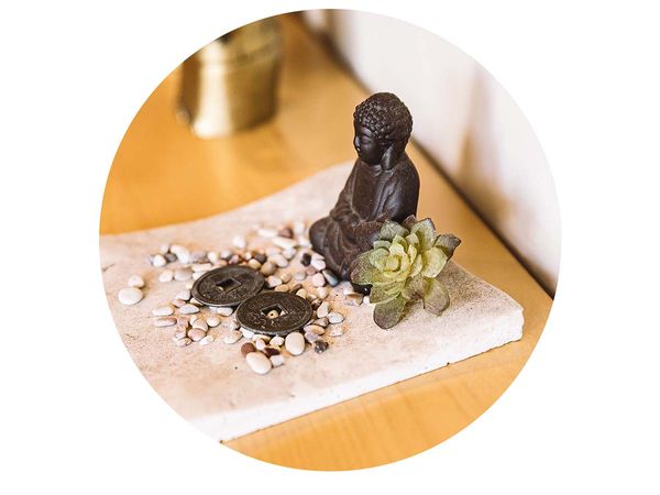 Small Buddha statue and stones