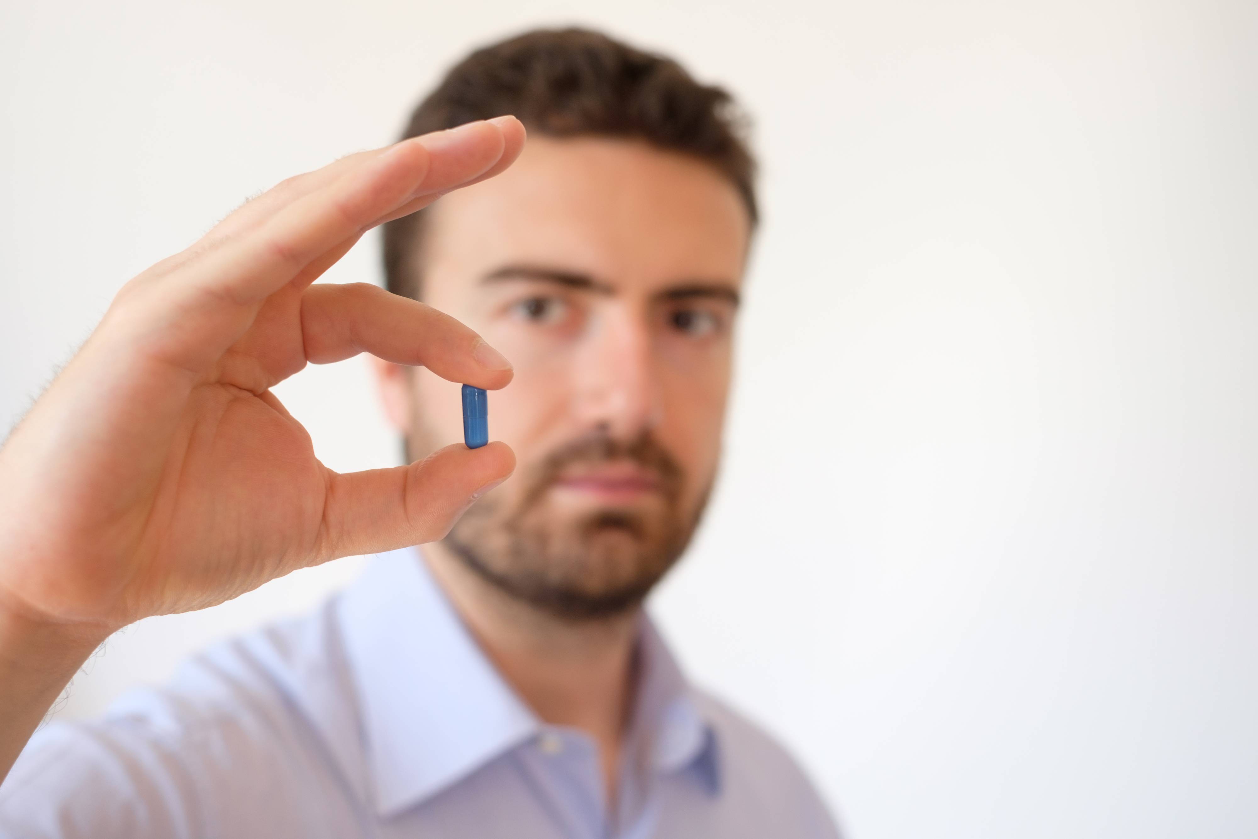 Image of a healthcare professional showing a pill Medication Therapy Management