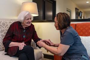 One of out caretakers and residents. Florida Senior Living Caregiver