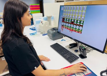 Lo Cost Pharmacy team preparing medications for blister packaging