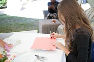 Camille Styles signing her book