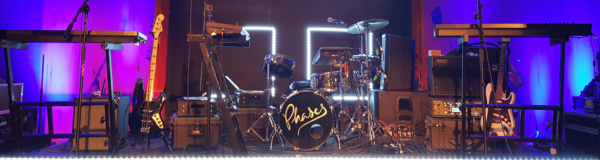 Instruments set up for a small band on stage