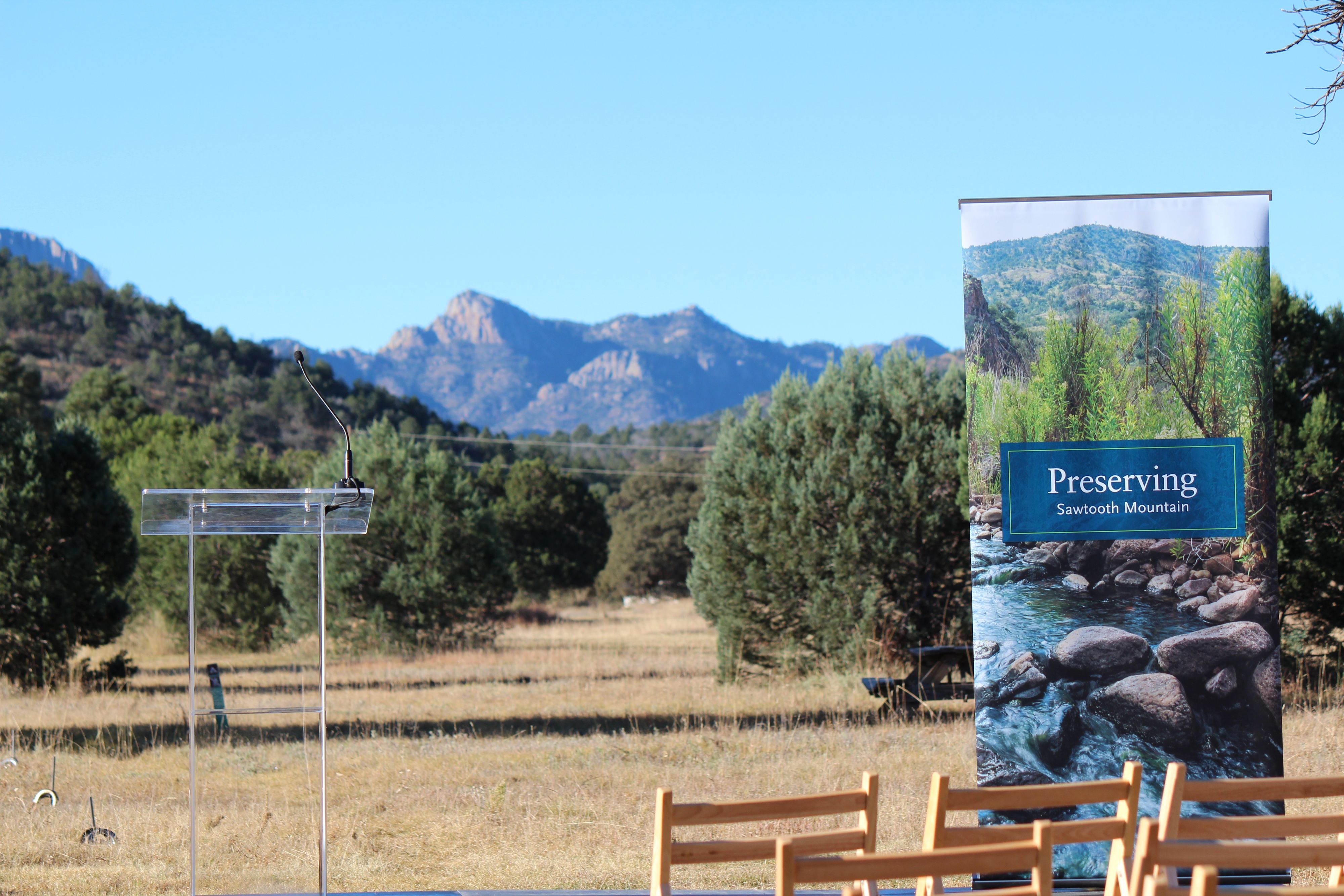 Outdoor meeting with a view of the mountains