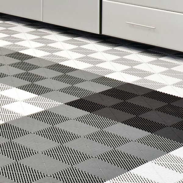 At Closets by Design, we also offer Designfloor® Traxtile. Available in a wide array of colors, styles, and patterns. Interlocking traxtile installs quickly and changes the game when it comes to keeping your space clean and comfortable. This Designfloor® tile system is perfect for garages, workout spaces, and playrooms. Traxtile is available in 15 3/4″ x 15 3/4″. Traxtile