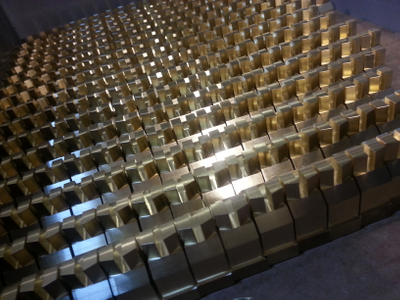 Brass components awaiting second operation in one of our vertical mills. 20130806_171049.jpg