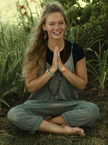 Chloe Groudas LMT, ERYT 500, Certified Hot Asana Assist, a Certified Massage Therapist, Certified Yin Yoga Teacher and Hot Asana Yoga University Lead Trainer Chloe Groudas