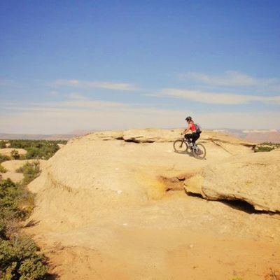 Lisa Pettit riding on the red rocks