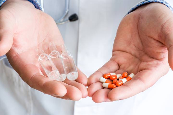 Pharmacist holding pills