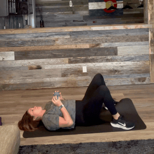 FIT4MOM chest press exercise with hip bridge for moms.gif