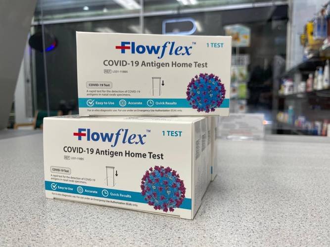 Two boxes of Flowflex COVID-19 antigen home tests Covid-19 Tests