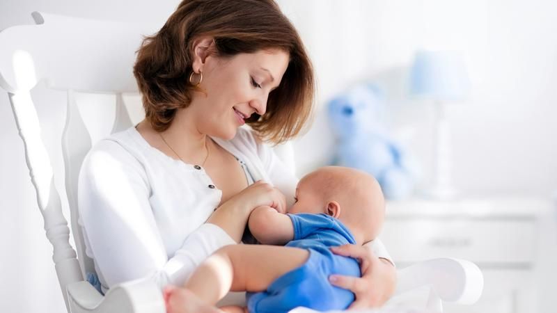 Breastfeeding mother finding relief with nipple cream