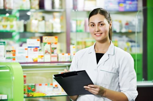Pharmacist Holding Clipboard at Rock Ridge Pharmacy